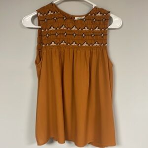 ana , pumpkin sleeveless top/blouse with  cute smocked details. PM,  EUC